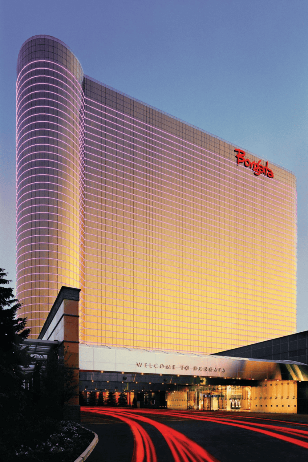 Brightly lit Borgata hotel with colorful neon lights, a popular destination for entertainment and nightlife.