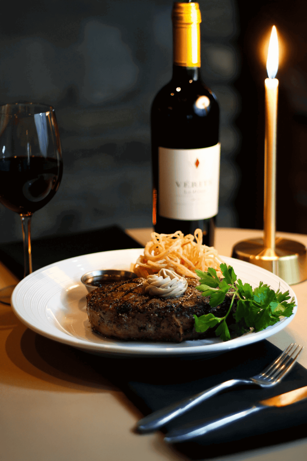 Succulent grilled steak with pasta, red wine, and candlelight dining for a memorable culinary experience.