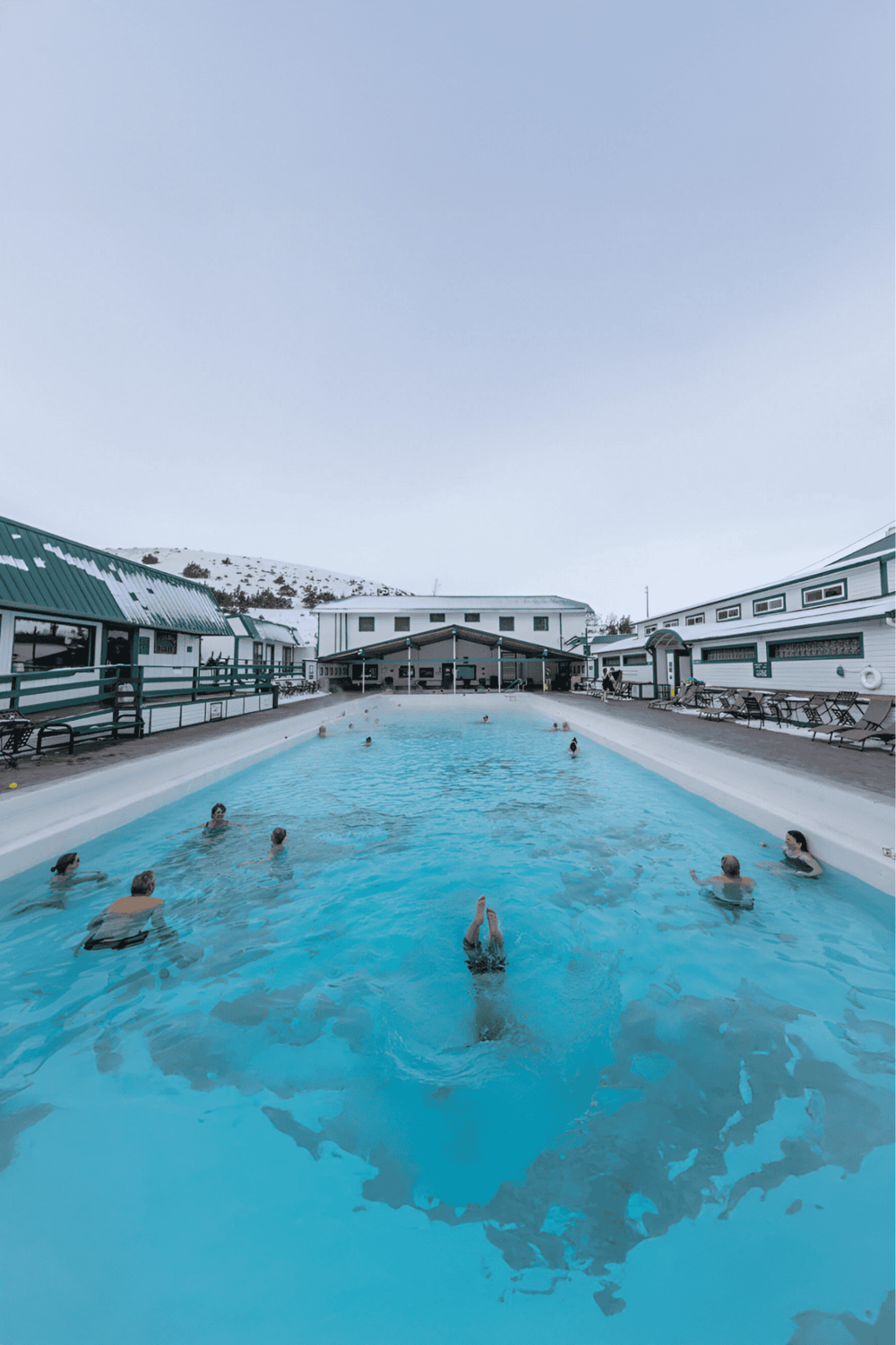 Relaxing outdoor hot spring pool with mountain views at Quest for Directions.