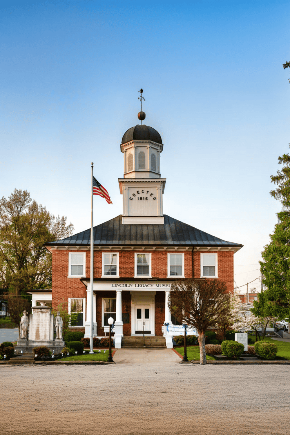 1. Historic Lincoln Legacy Museum building in Ohio, built in 1816 with American flag.