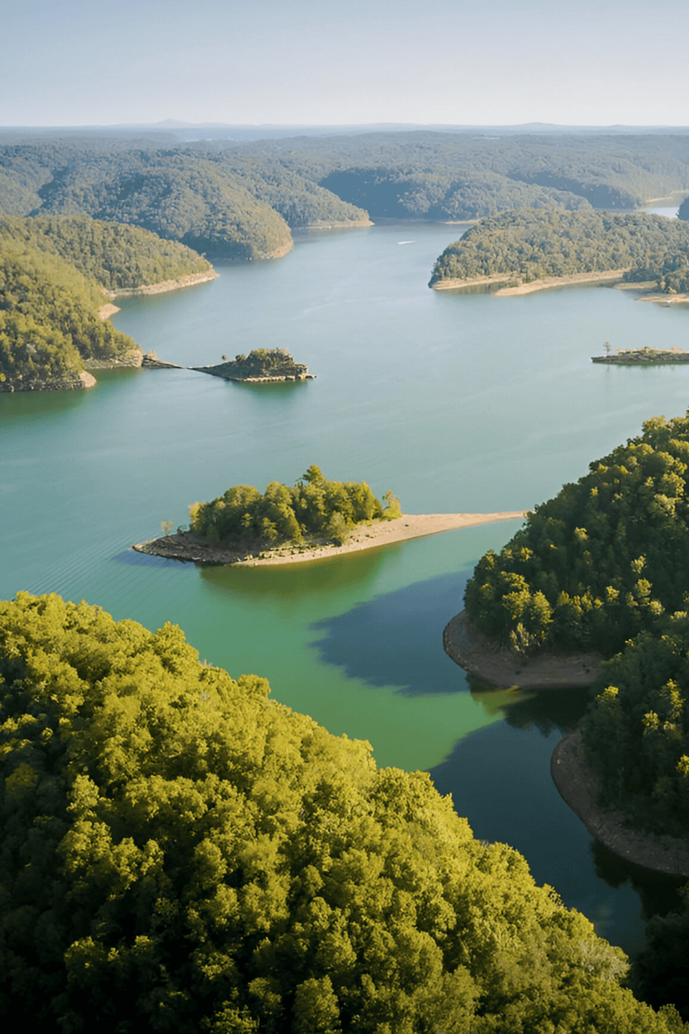 Serene river view with lush green hills and small islands, perfect for outdoor adventures and scenic exploration.