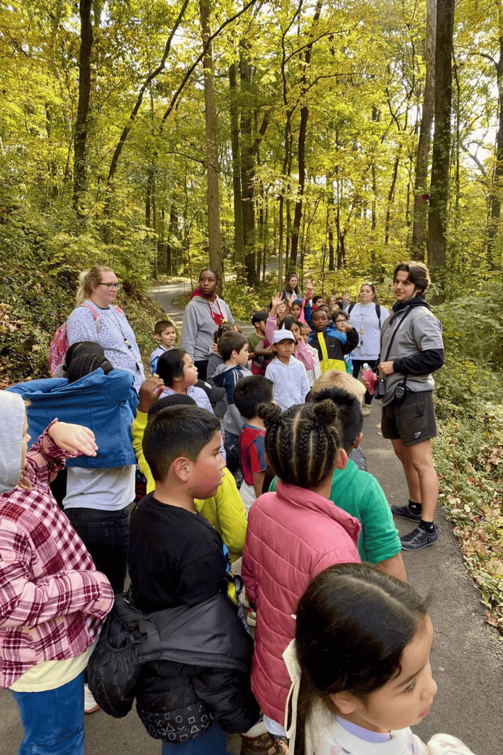 Exploring nature with children during an outdoor educational tour at QuestForDirections.