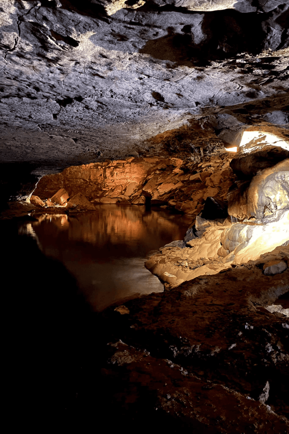 Hidden cave with underground water pool in QuestForDirections adventure site.