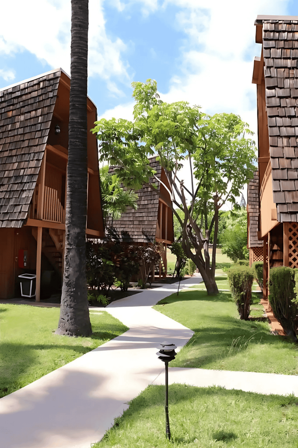 Spacious wooden vacation rental cabins with lush greenery and scenic surroundings, perfect for relaxing retreats.