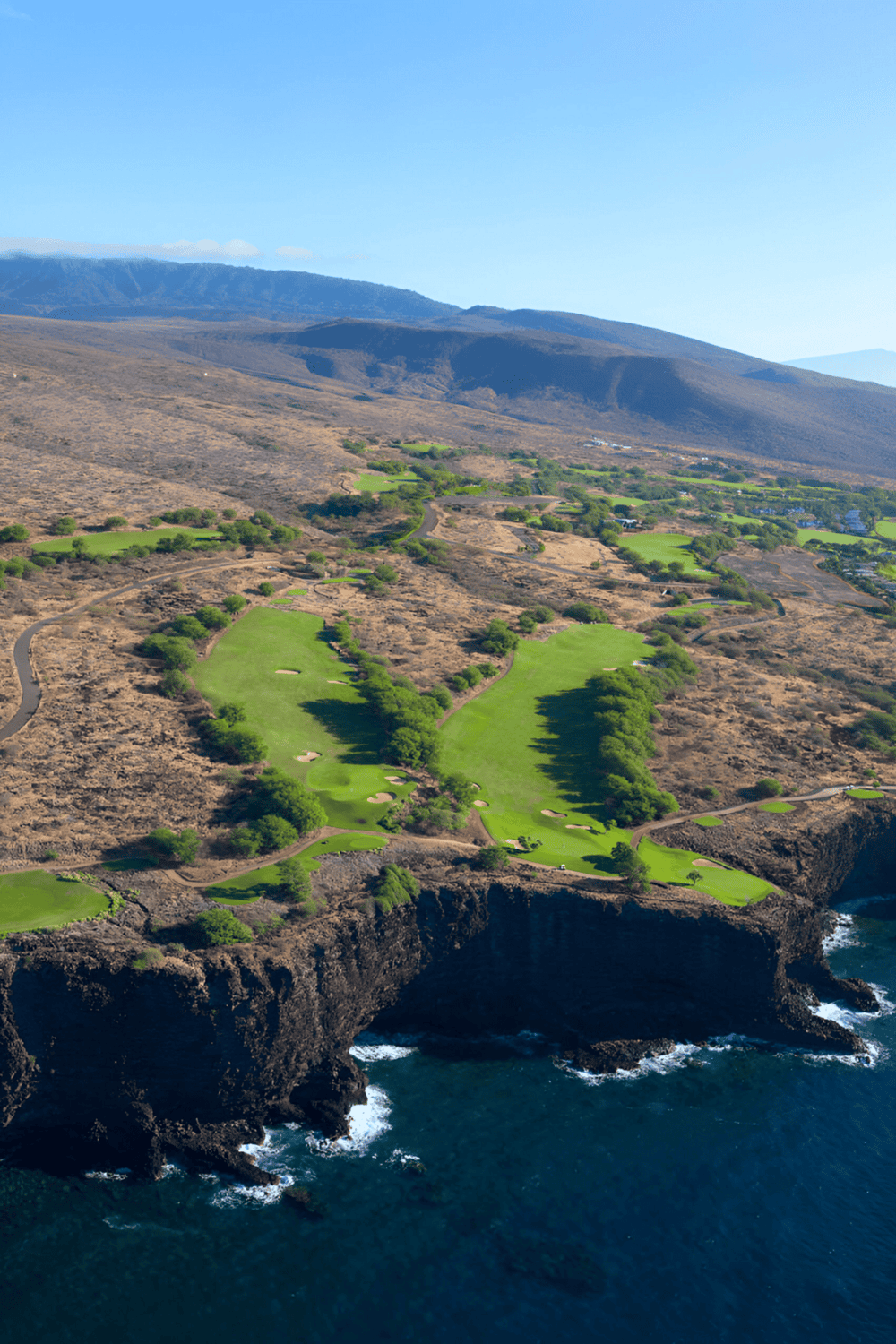 Seaside golf course with scenic ocean views and lush fairways in a coastal setting.