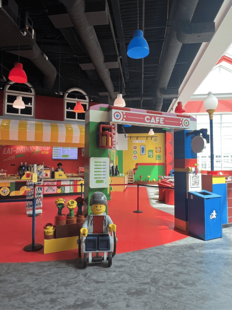 Colorful LEGO-themed indoor cafe and play area at Quest For Directions. Ideal for kids' entertainment and family outings.