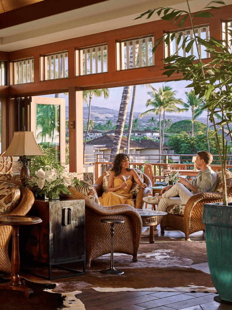 Relaxing tropical lounge with tropical decor and scenic mountain views.