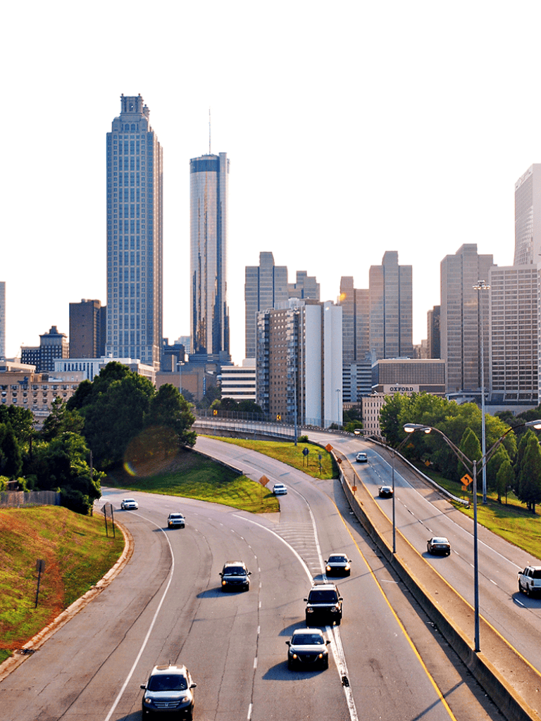 City skyline with skyscrapers and busy highway in Atlanta, Georgia, urban travel, navigation, route planning, QuestForDirections.