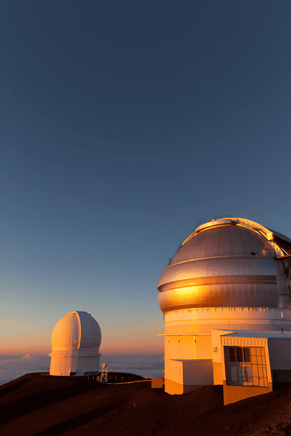 Telescopic observatories at sunset, QuestForDirections professional astronomy services, clear sky night sky exploration, advanced telescopes for stargazing.