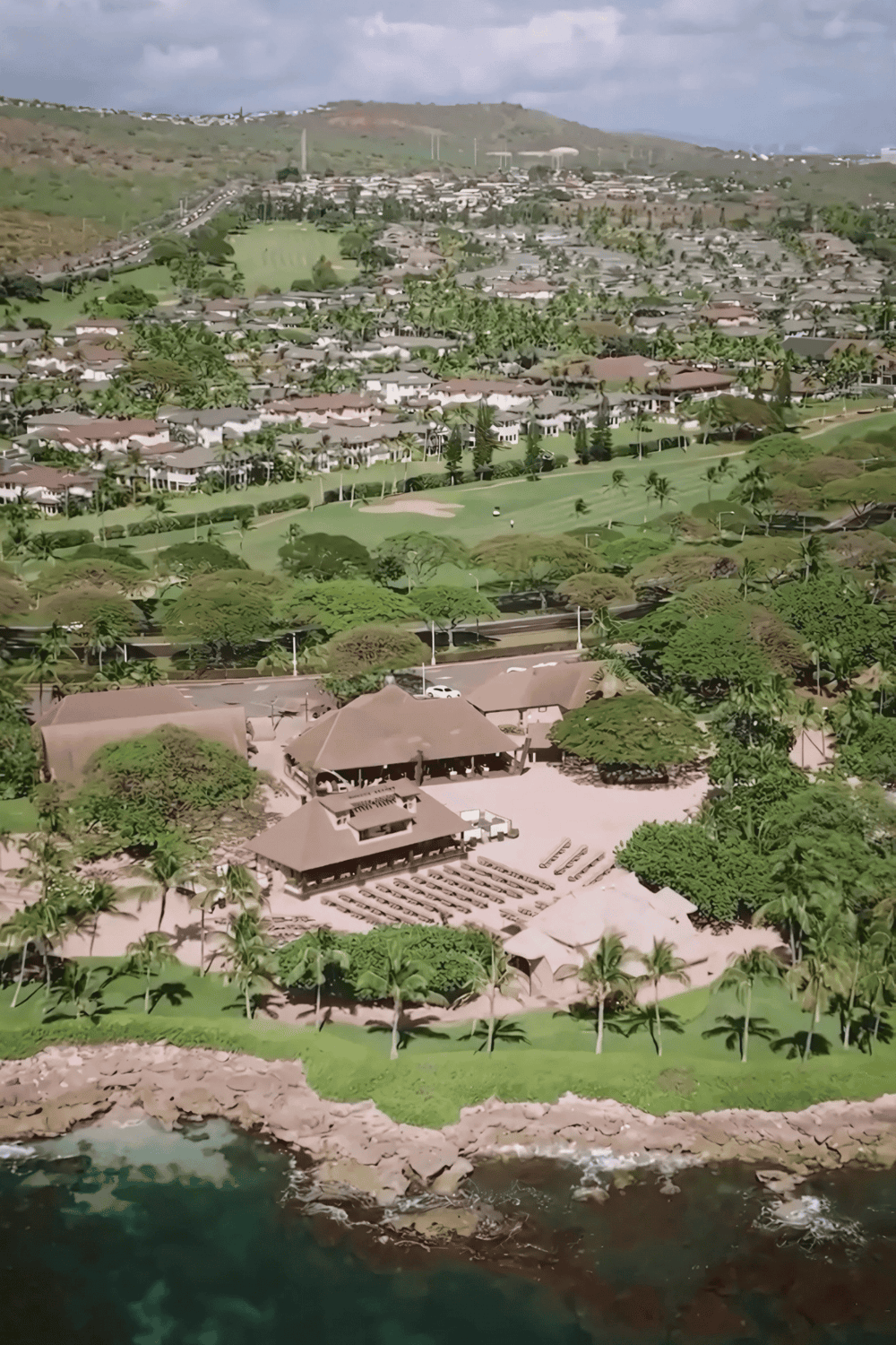 Resort with lush greenery and oceanfront views, ideal destination for relaxation and travel planning.