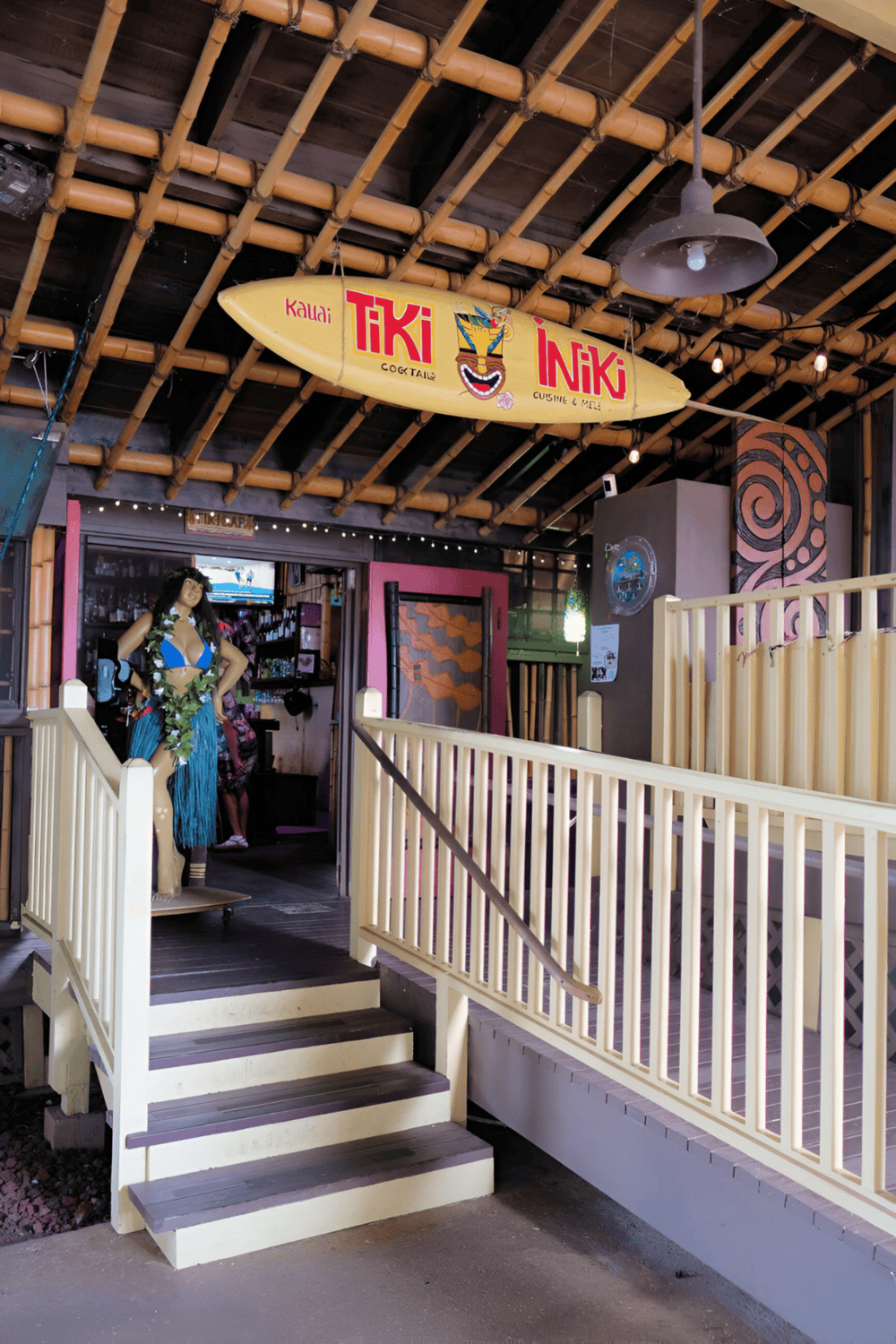 Colorful Hawaiian tiki bar with Polynesian decor and bamboo accents, perfect for island-inspired dining and cocktails.