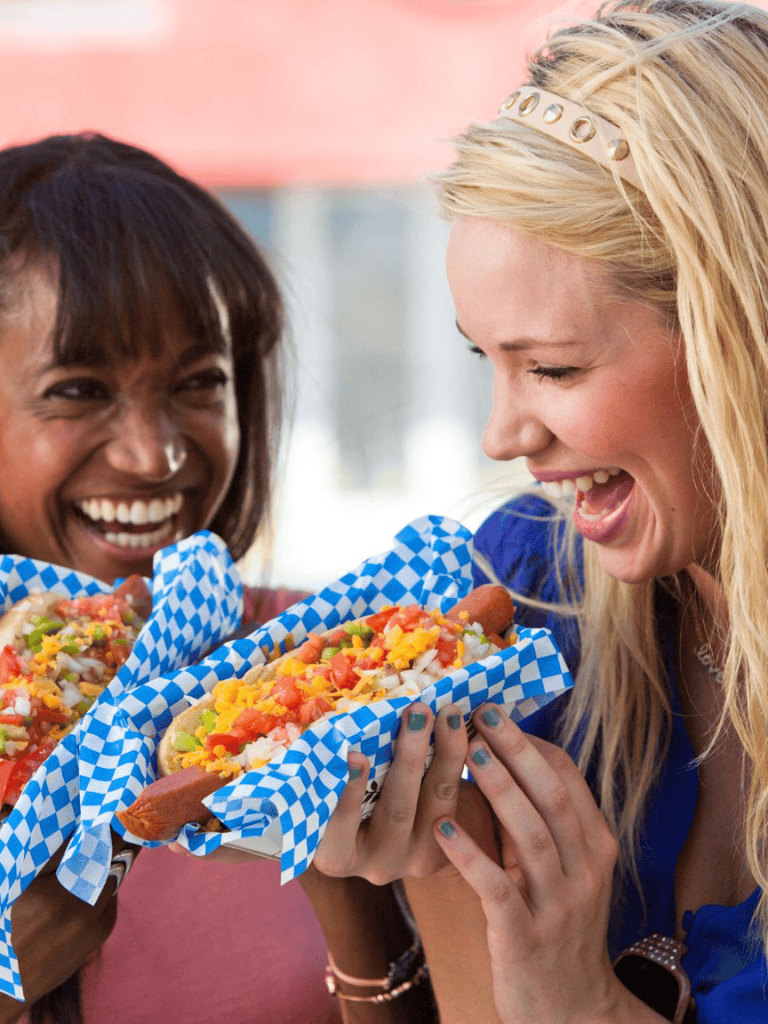 Delicious tacos with vibrant toppings, shared joyfully between friends at QuestForDirections event.