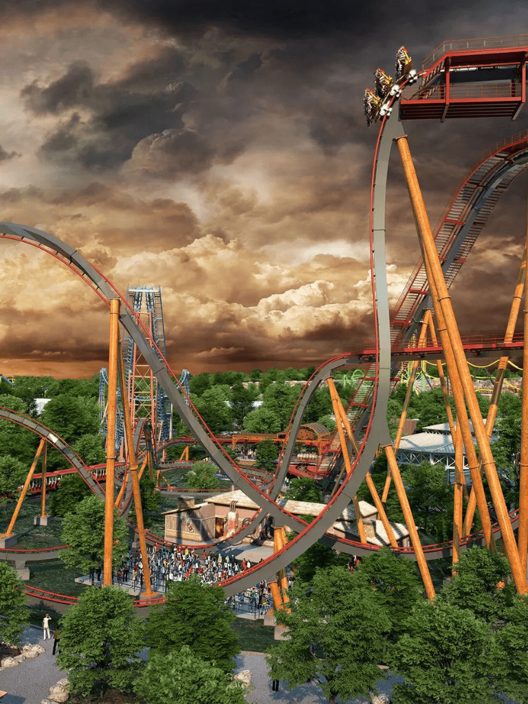 Thrilling roller coaster at Quest for Directions amusement park during dramatic sunset.