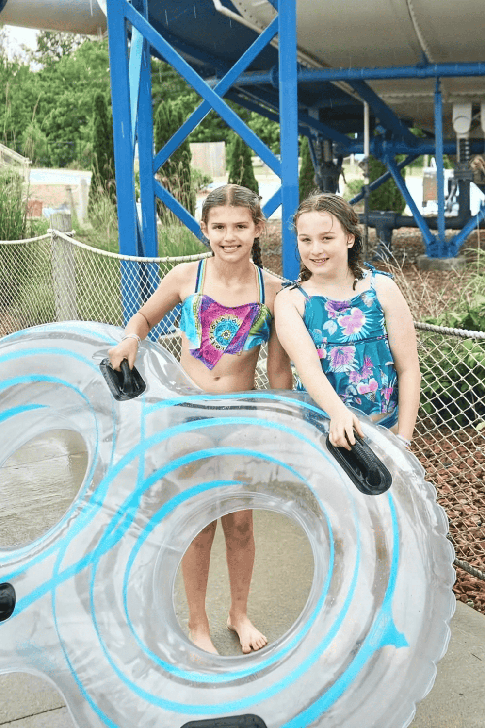 Inflatable tube ride at QuestForDirections water park with children enjoying summer fun.