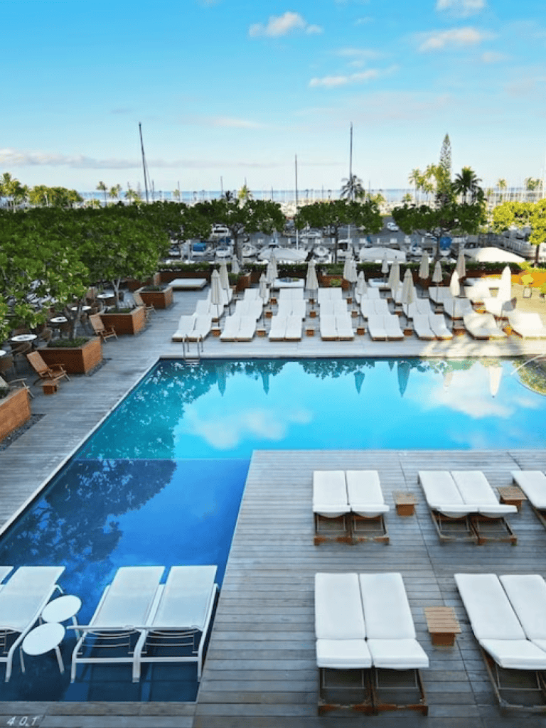 Relaxing poolside with ocean views at QuestForDirections beachfront resort.