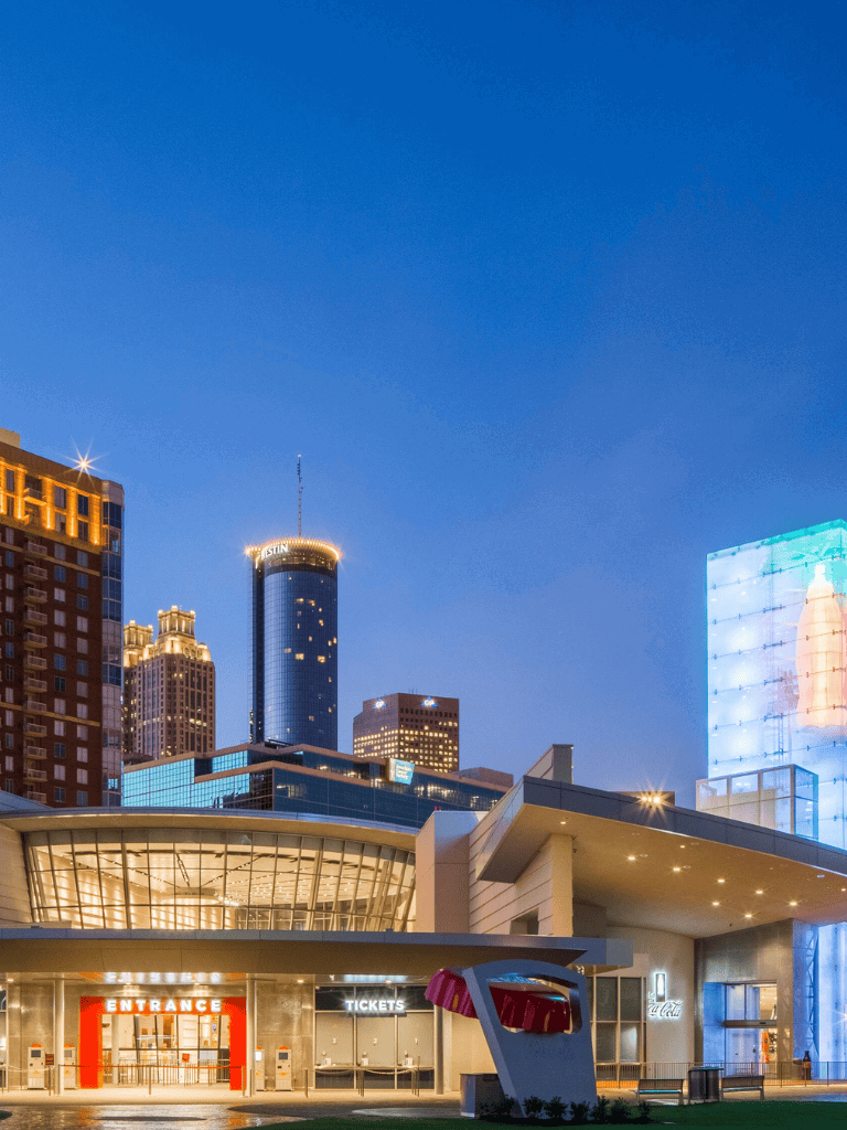 Modern downtown cityscape with iconic buildings and vibrant nightlife in QuestForDirections image.