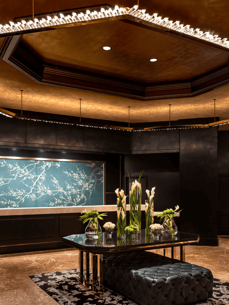 Elegant hotel lobby with floral arrangements and sophisticated lighting for luxurious ambiance.