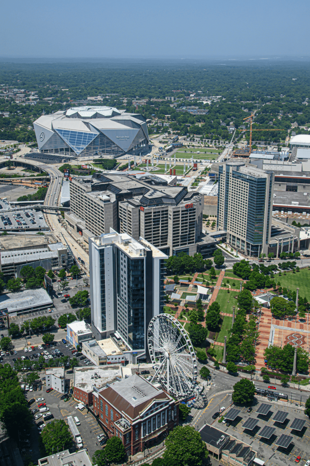 Aerial view of downtown Nashville showing the Nissan Stadium, downtown hotels, and the Nashville skyline.