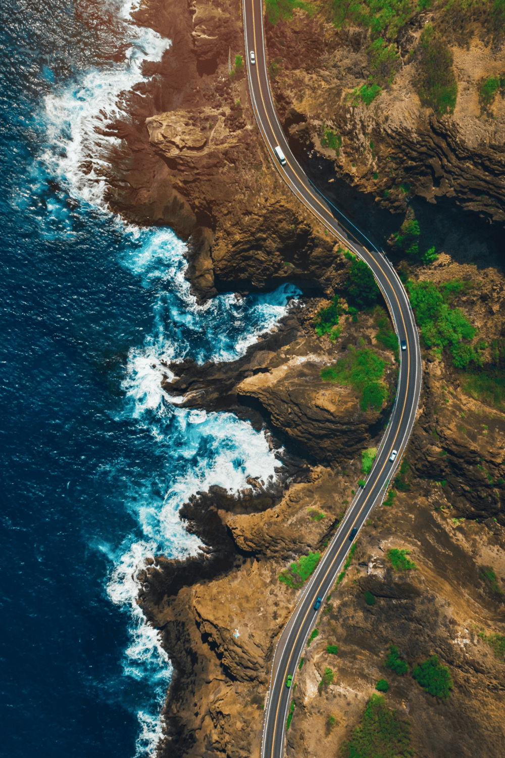 Seaside scenic highway with ocean cliffs and winding road, travel along coastal route.