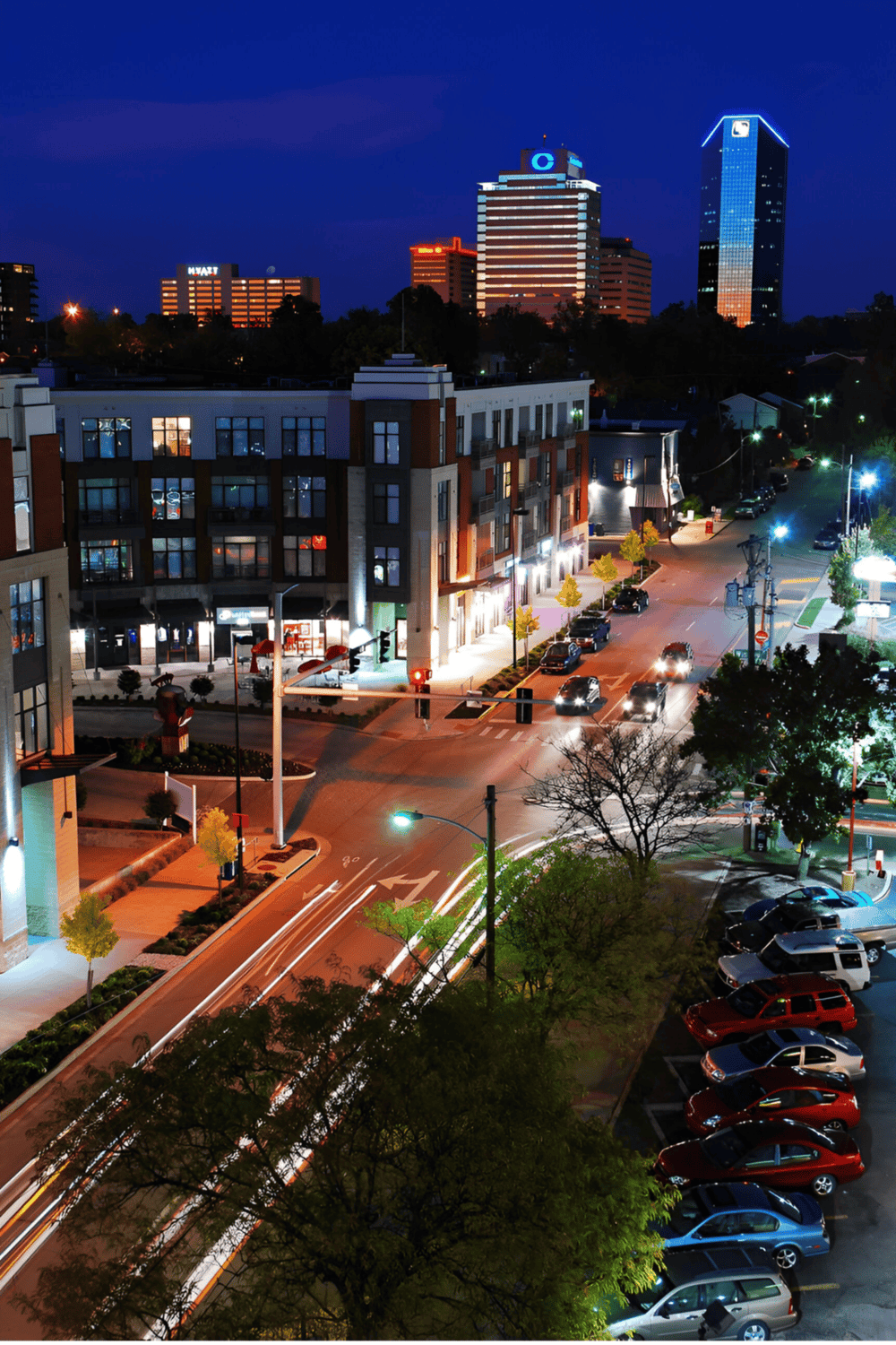 Night city skyline with illuminated buildings and bustling streets in downtown QuestForDirections area.