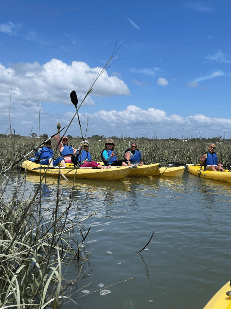 Kayaking adventure in marshlands with QuestForDirections outdoor trip.