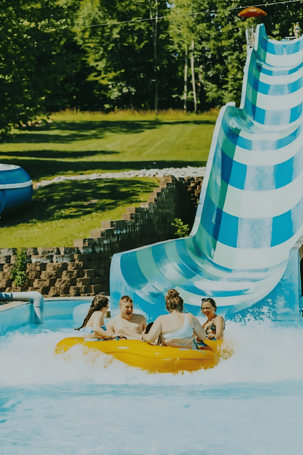 Exciting water slide and family enjoying water park adventure at Quest for Directions.