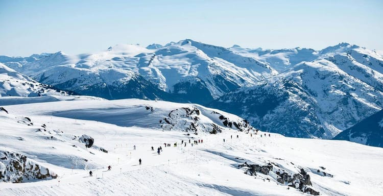 Snowy mountain landscape with skiers in pristine winter conditions, perfect for winter sports and outdoor adventures.