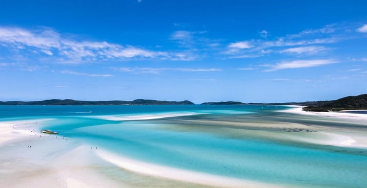 Turquoise coastal waters and white sandy beaches at QuestForDirections, perfect for travel and navigation guides.