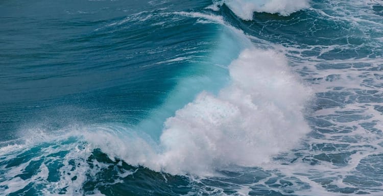 Vibrant ocean waves crashing, perfect for surfing and sea adventure travel.