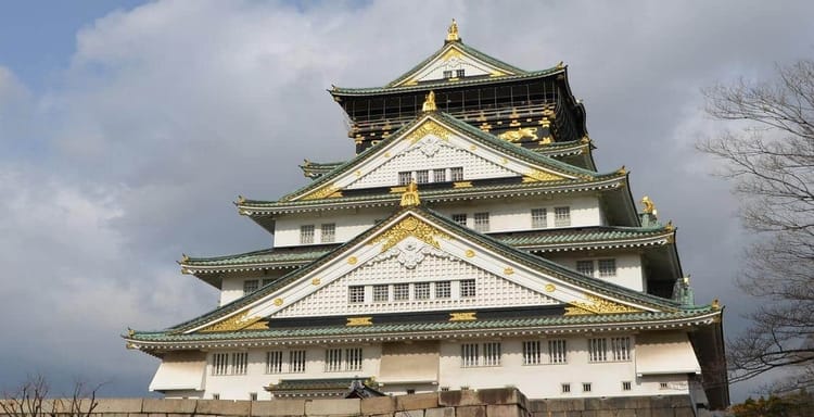 Historic Japanese castle with traditional architecture and gold embellishments, popular travel destination.