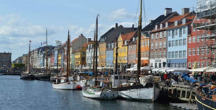 Colorful waterfront houses and boats at Nyhavn in Copenhagen, Denmark.
