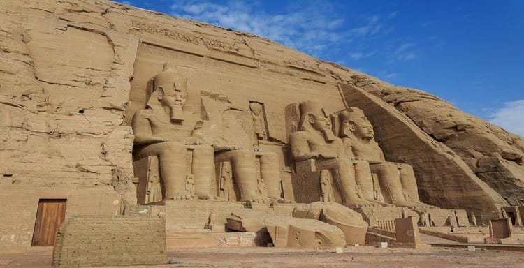Ancient Egyptian colossal statues at Abu Simbel, a UNESCO World Heritage site, showcasing Egypt’s monumental history.