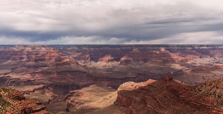 Vivid view of the Grand Canyon showcasing layered rock formations and dramatic landscape.
