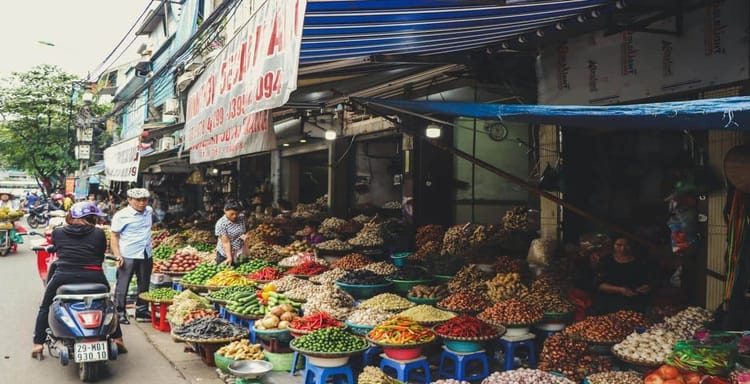 Fresh produce market in Vietnam, vibrant vegetables and spices in a local street shop.