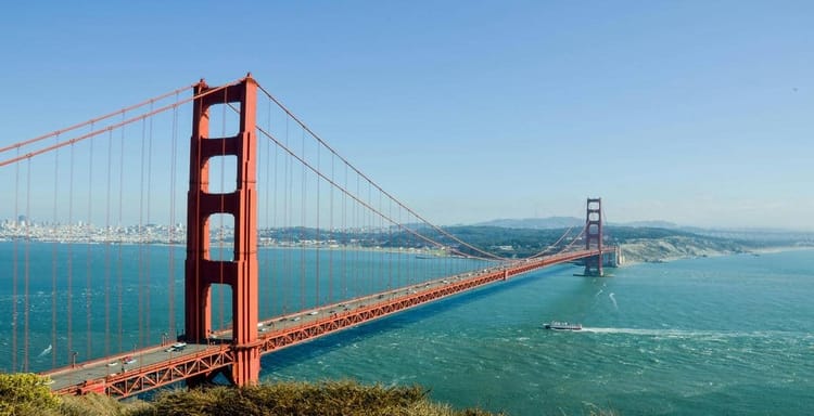 Golden Gate Bridge, San Francisco, California, picturesque view with blue sky and water.