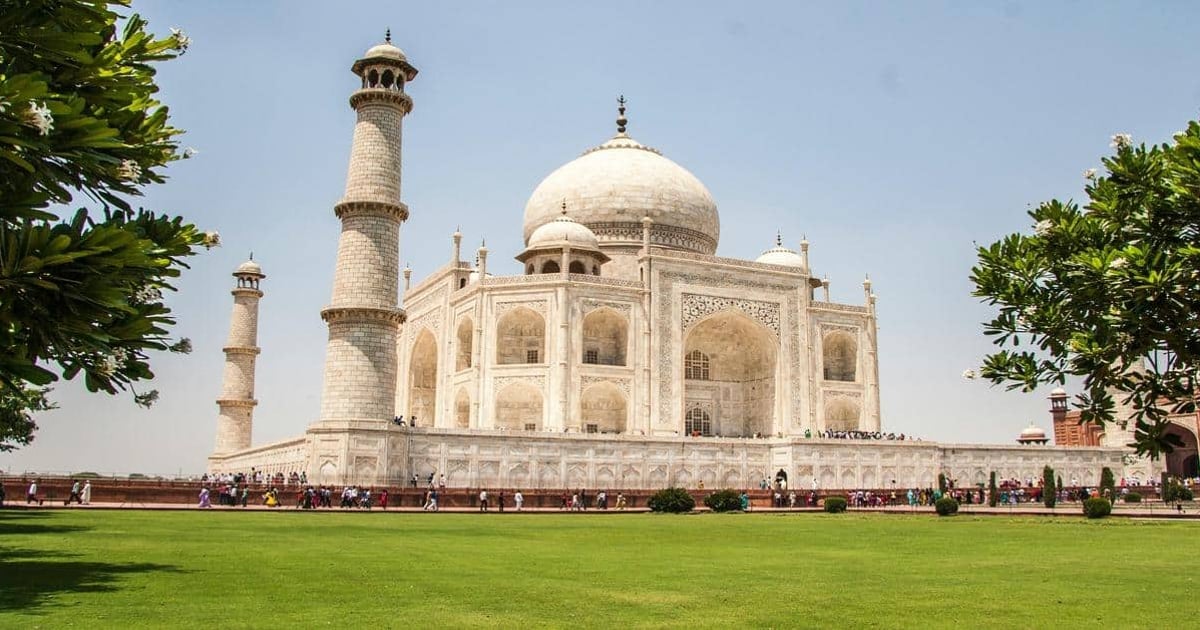 Magnificent Taj Mahal with lush gardens, iconic Indian heritage site, and tourism destination.