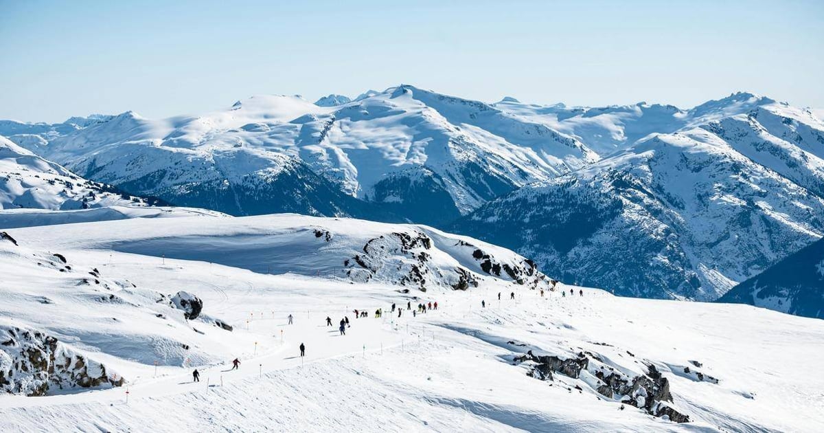 Snowy mountain landscape with skiers in pristine winter conditions, perfect for winter sports and outdoor adventures.