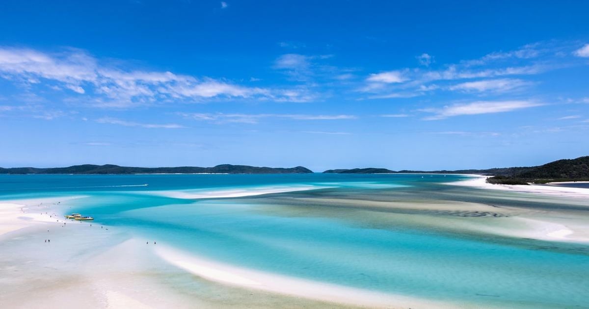 Turquoise coastal waters and white sandy beaches at QuestForDirections, perfect for travel and navigation guides.