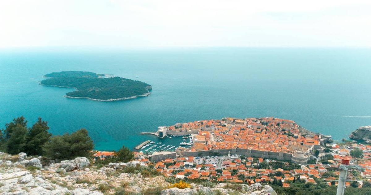 Historic coastal city with ancient walls and harbor, overlooking the Adriatic Sea in Croatia.