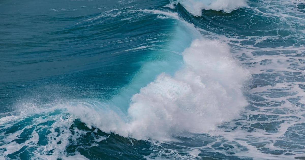 Vibrant ocean waves crashing, perfect for surfing and sea adventure travel.