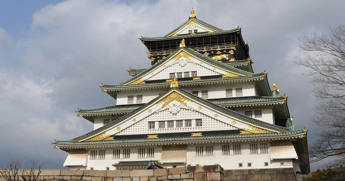Historic Japanese castle with traditional architecture and gold embellishments, popular travel destination.