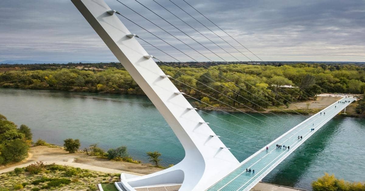 Modern suspension bridge over a river in Austin, Texas, showcasing innovative architecture and scenic views.