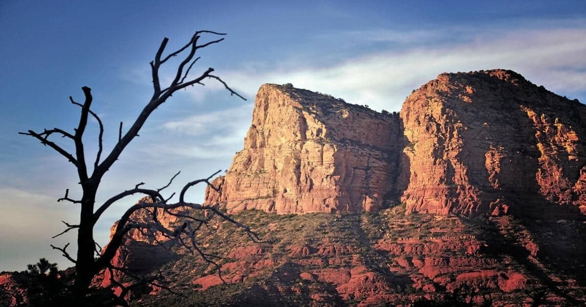 Breathtaking red rock formations in Sedona at sunset, perfect for outdoor adventures and scenic drives.