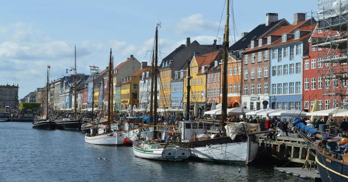Colorful waterfront houses and boats at Nyhavn in Copenhagen, Denmark.