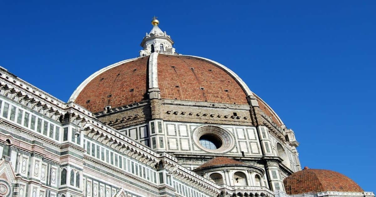 Majestic Florence Cathedral dome in Italy with intricate architecture and vibrant blue sky fill.