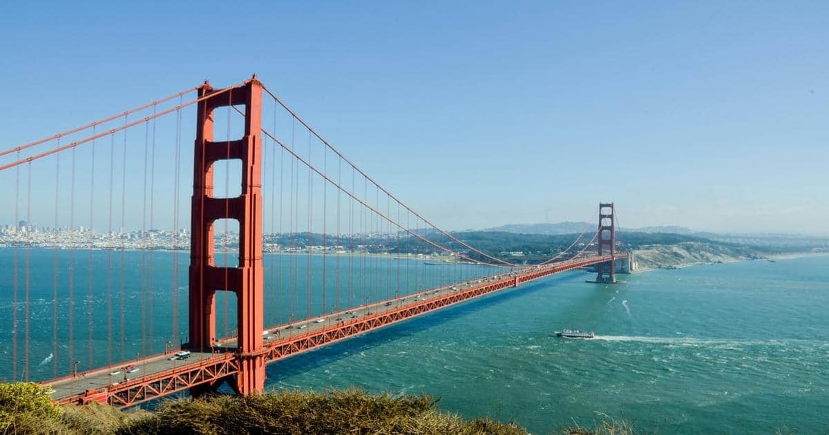 Golden Gate Bridge, San Francisco, California, picturesque view with blue sky and water.